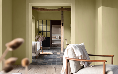 Looking through livingrooms, with walls painted in straw yellow